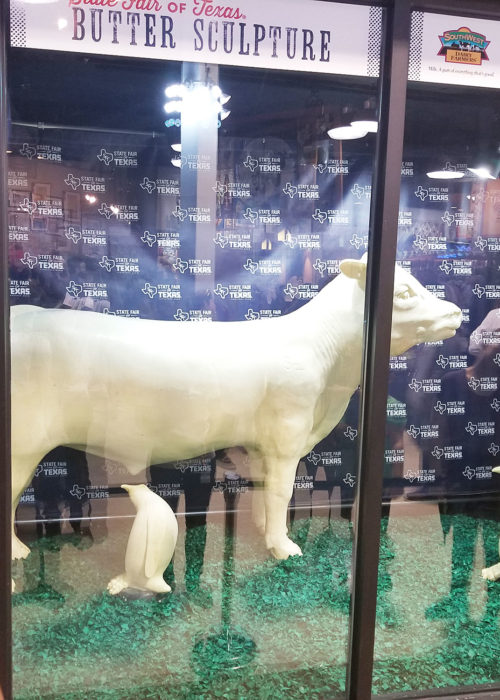 State Fair of Texas butter sculptures. Why are the penguins eyeing the cow?