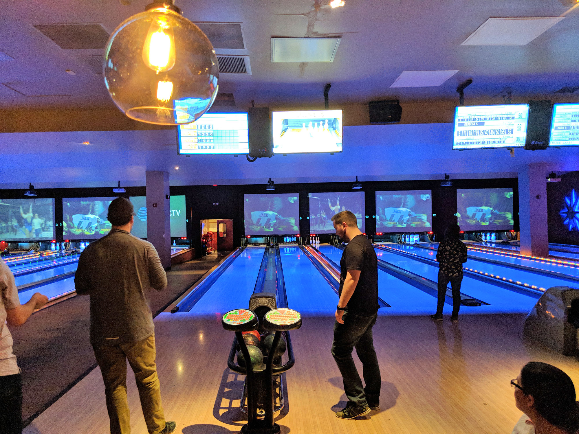 Trying our best to win the game during our weekly bowling league.