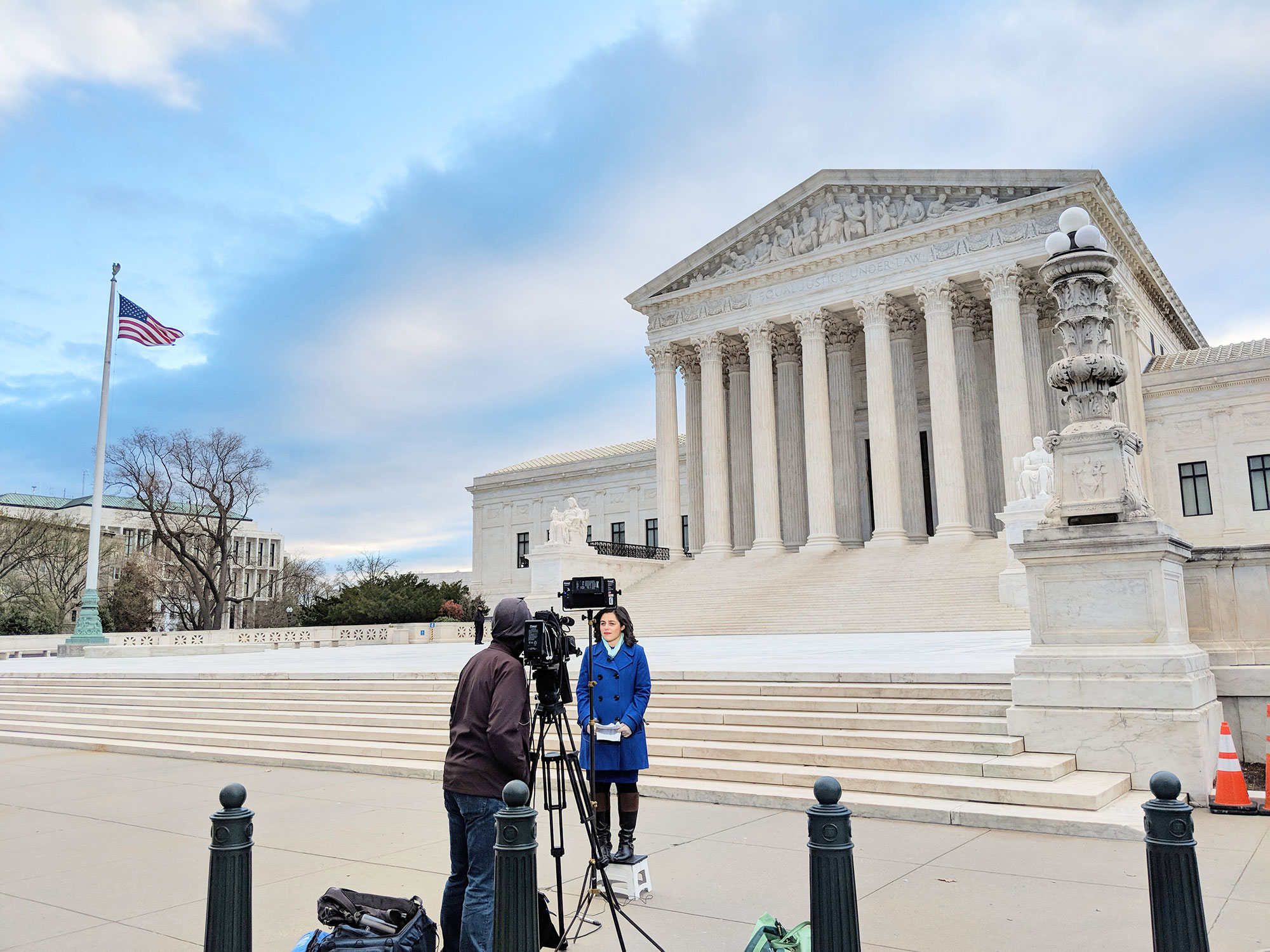 A reporter covering the South Dakota v Wayfair case in front of the Supreme Court.