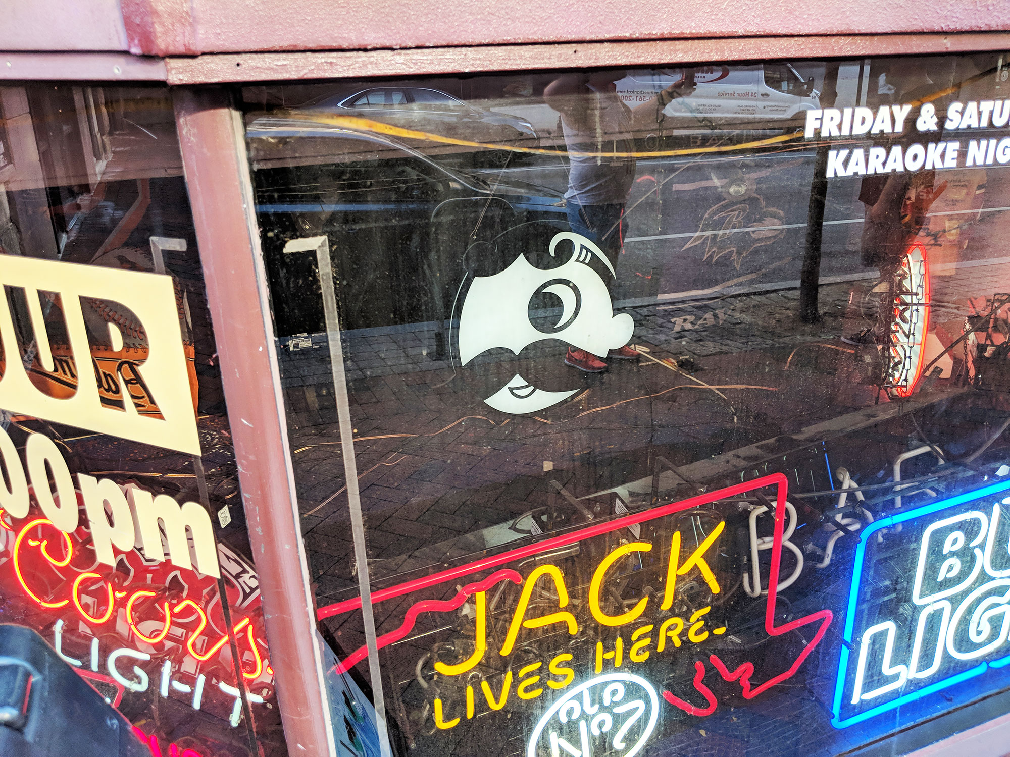 A collection of beer signs, including National Bohemian.