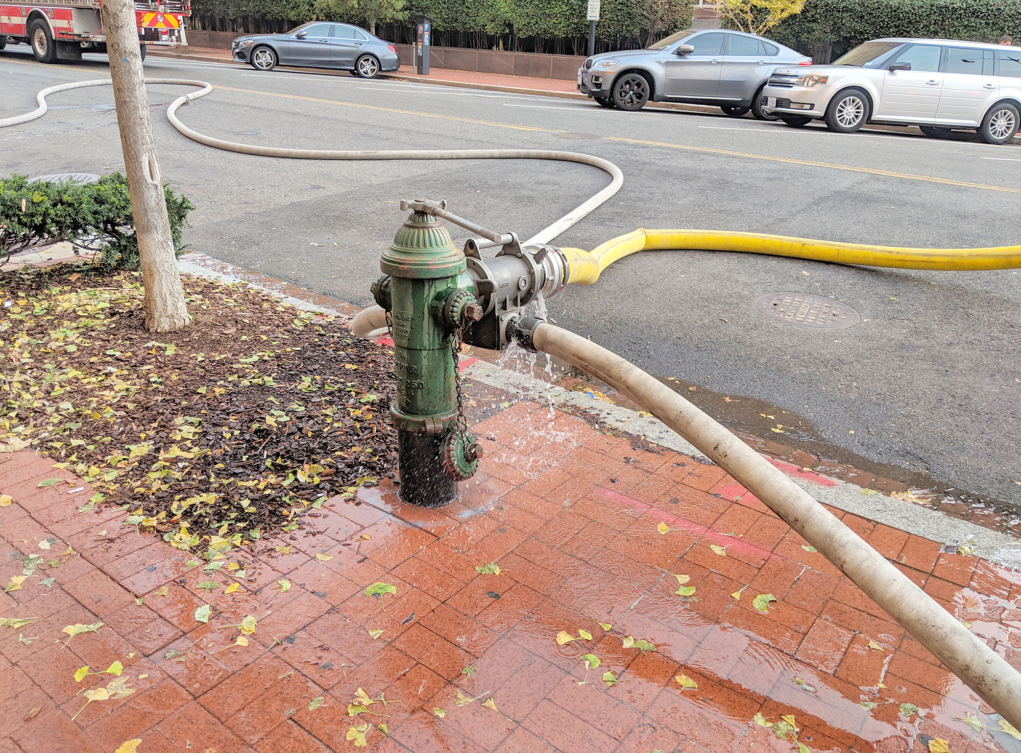 A fire hydrant being used in Chinatown, Washington, DC