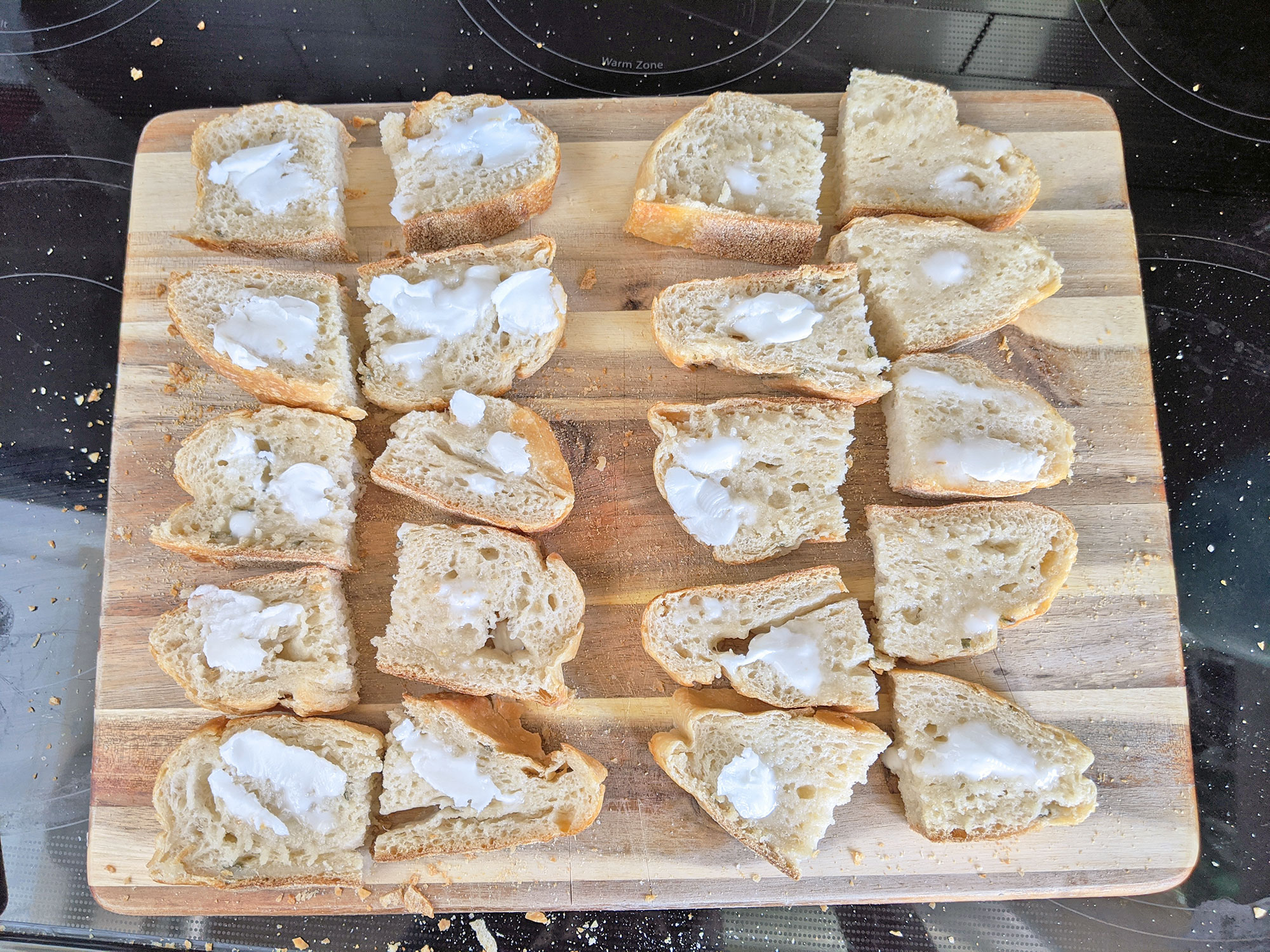 Buttering the bread in preparation for the German-style breakfast sandwiches.