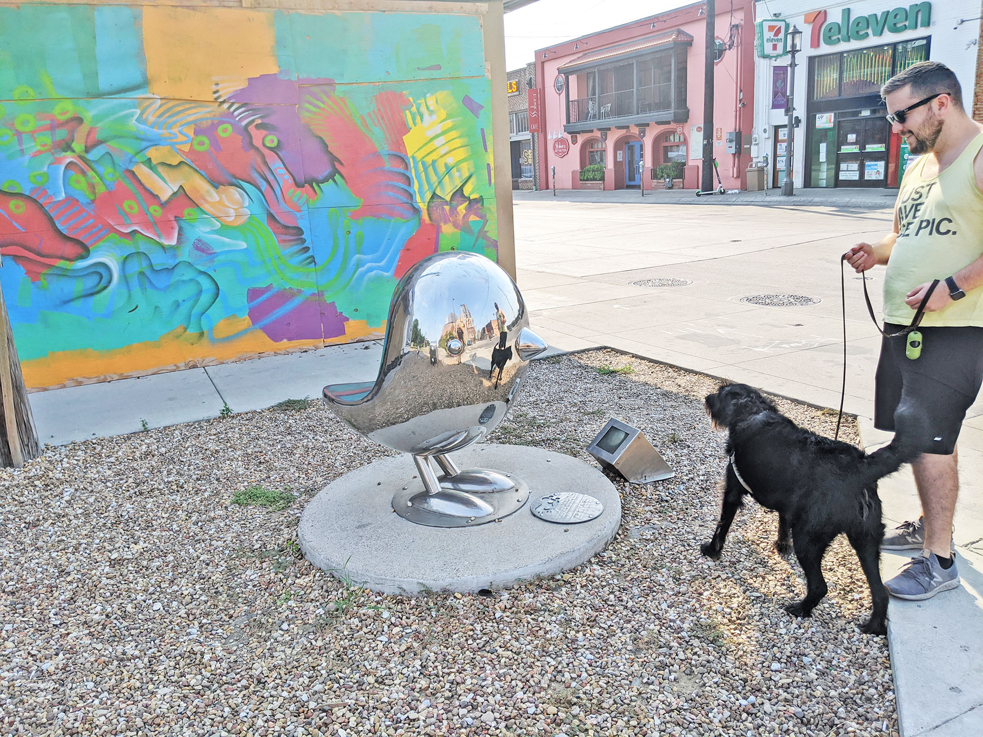 Ingrid the labradoodle and a creepy bird sculpture in Deep Ellum, Dallas.