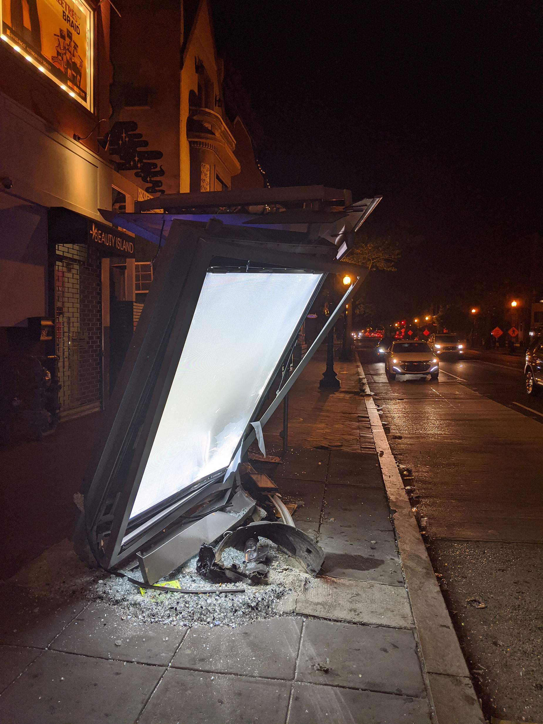 A destroyed bus stop in Washington DC that was hit by a drunk driver.