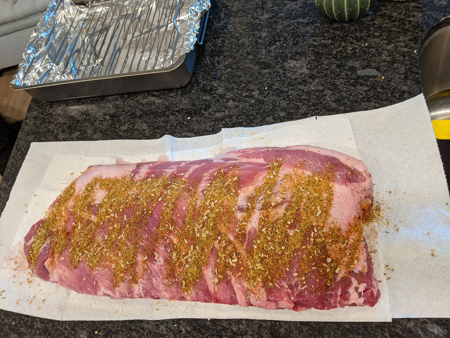 Seasoning the pork ribs.