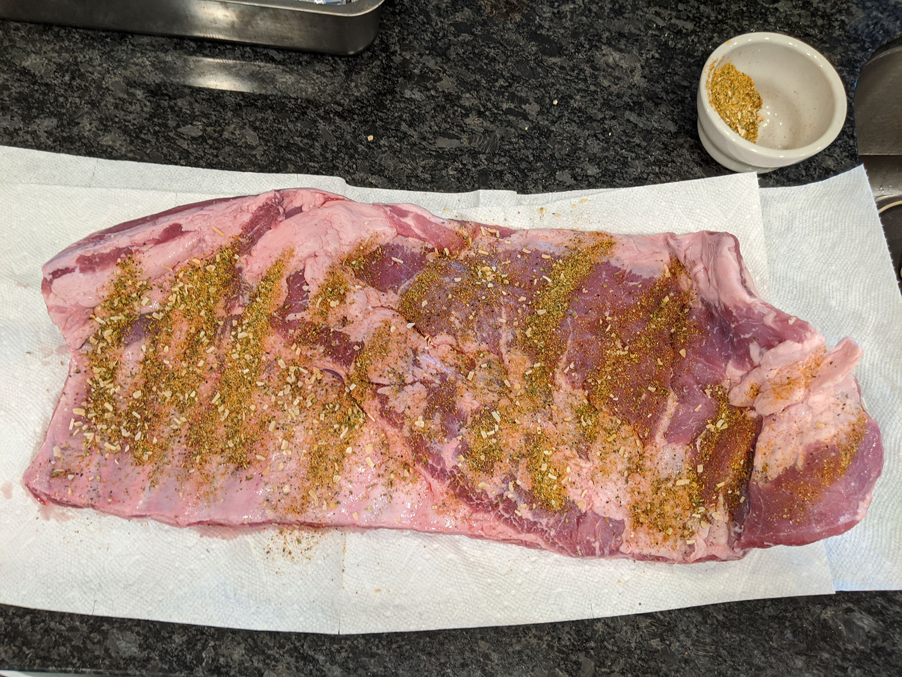 Seasoning the pork ribs.