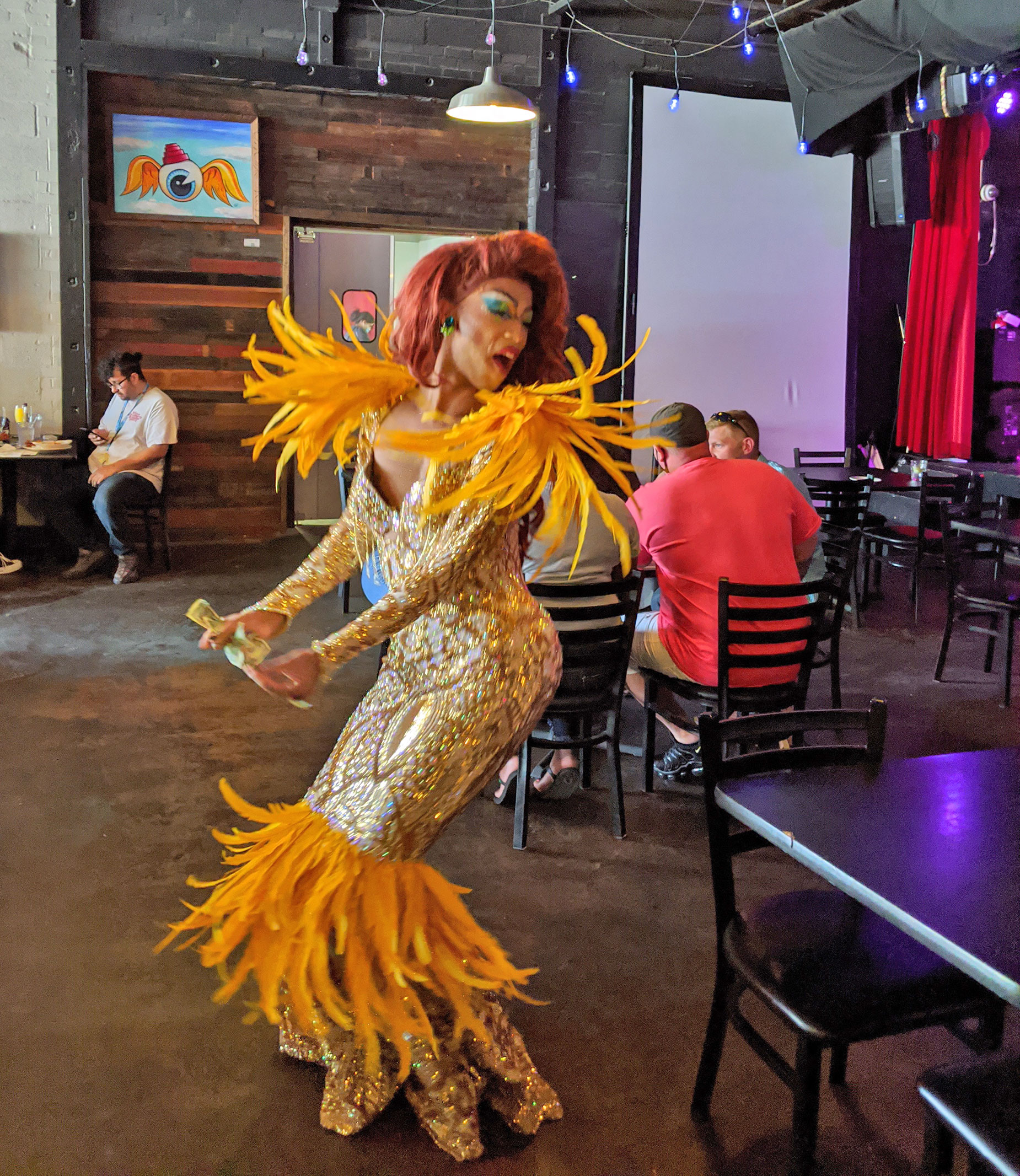 Dallas drag queen Kylee O'Hara Fatale performing in a gown.