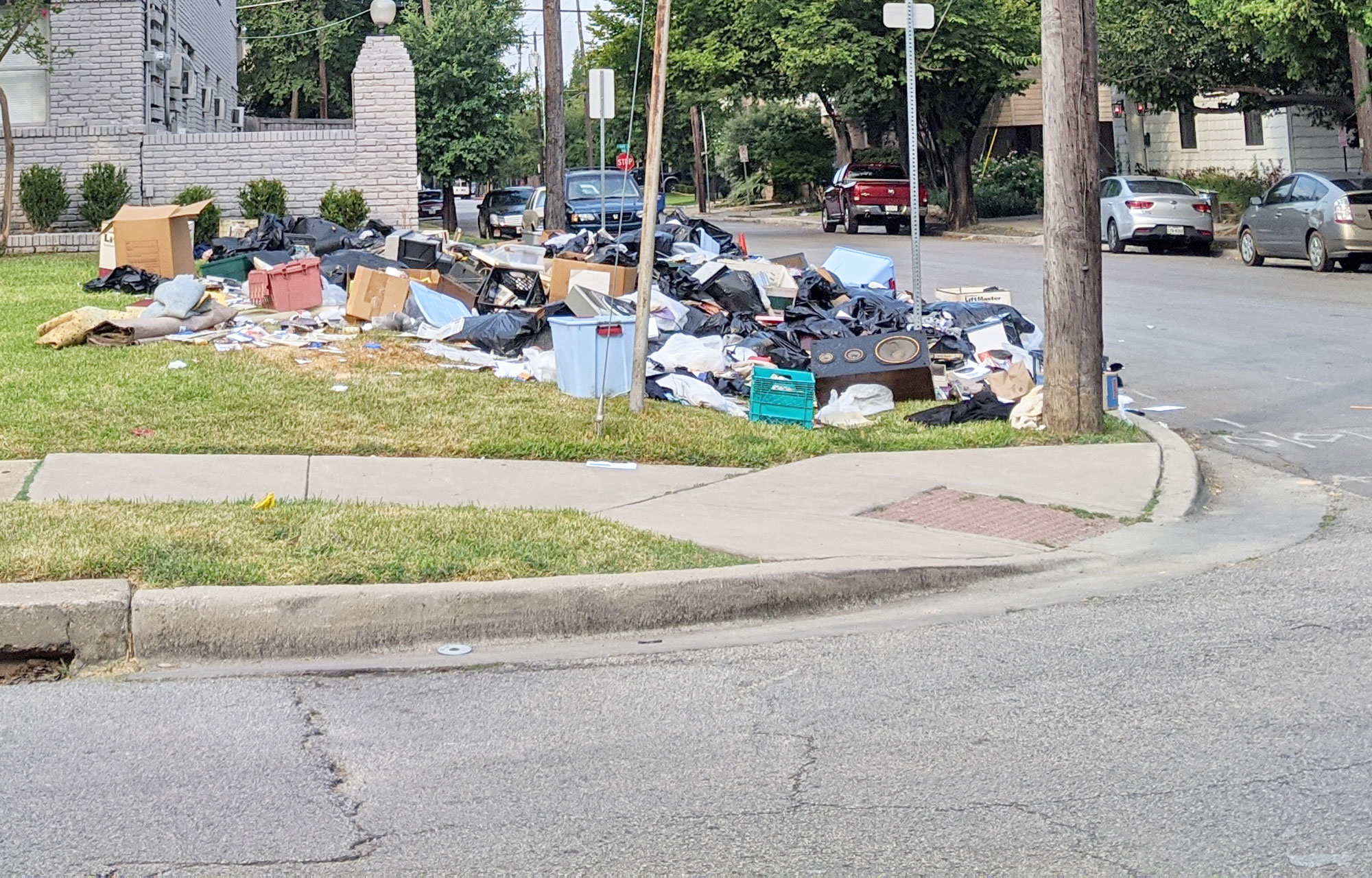 Trashed yard in Oak Lawn, Dallas.