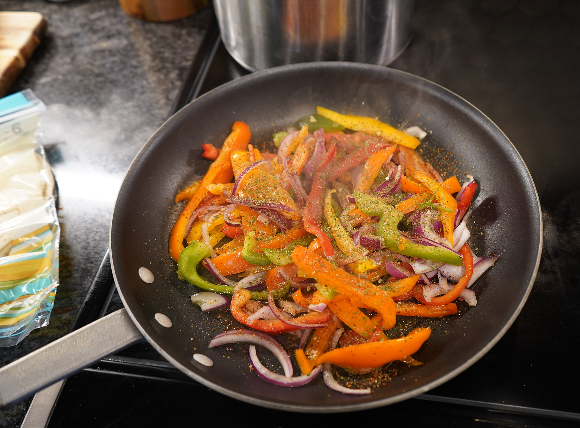 Grilling the fajita vegetables.