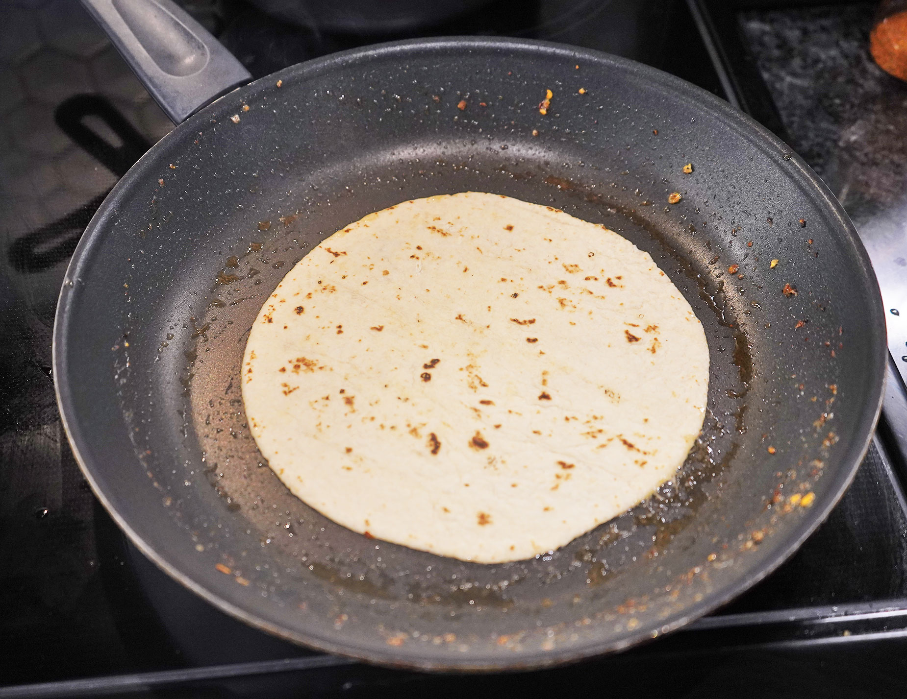 Frying the tortillas for tacos.