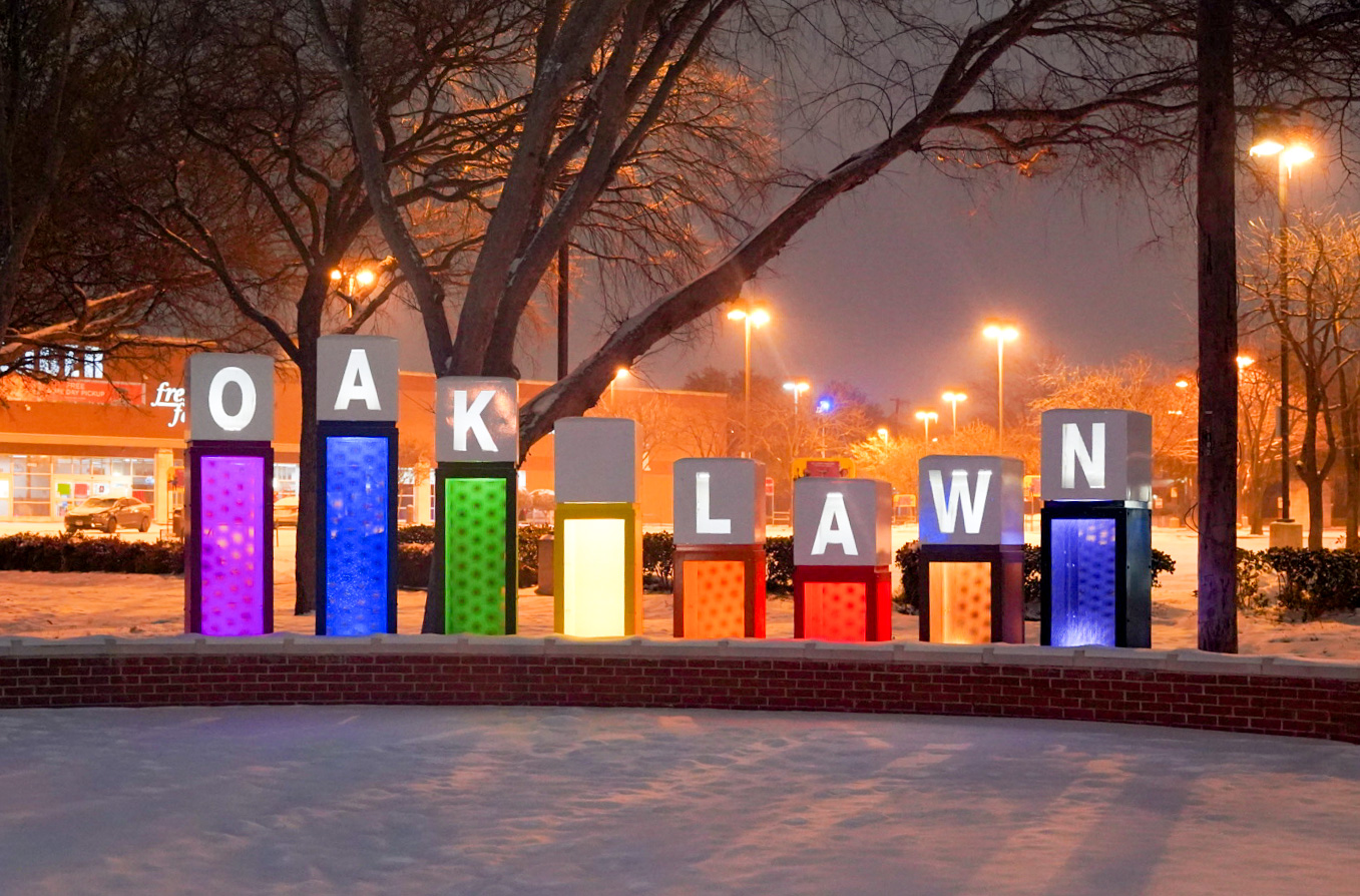 The rainbow Oak Lawn entry sign during the 2021 snow storm.